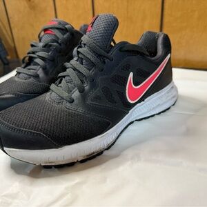 Nike Black Sneakers with Pink Swoosh and White Midsole